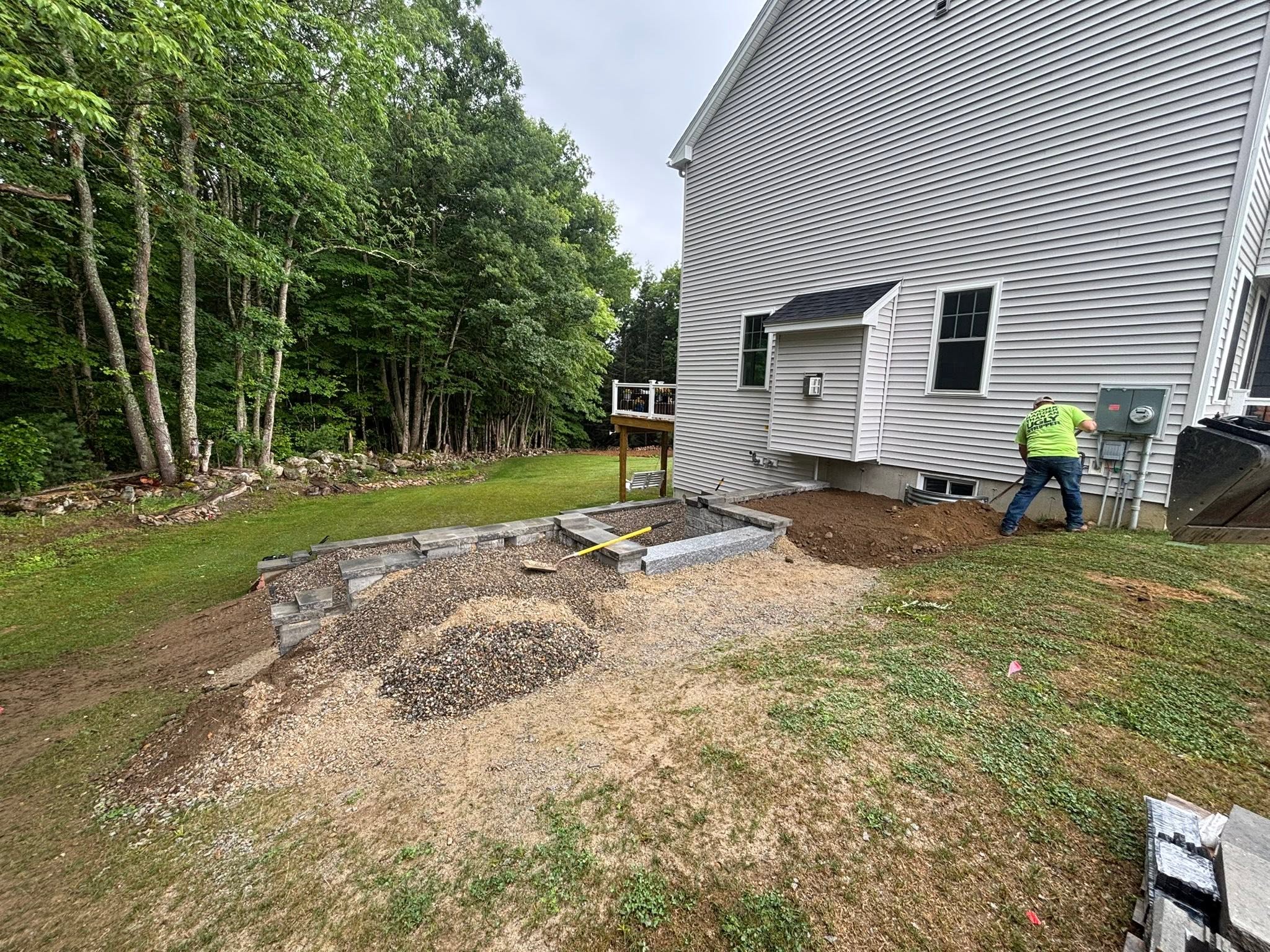 Eroded slope before stone retaining wall — East Brookfield, MA